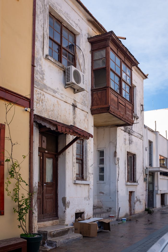 Charming rustic buildings on a Mediterranean street reflecting timeless architectural style.